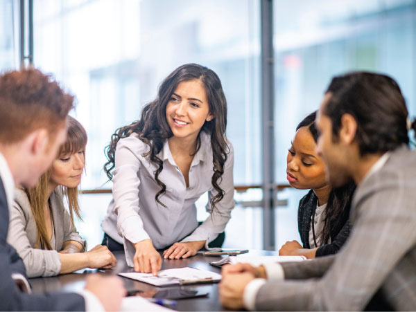 A group of business professionals during coaching.